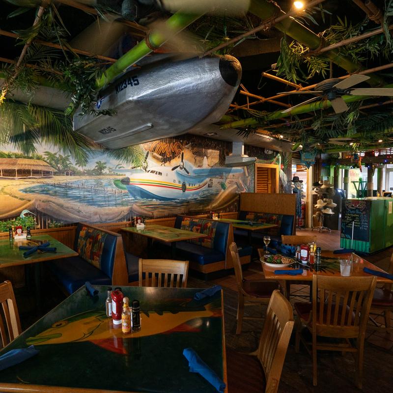 Interior, dining room, seating, a large plane model on the ceiling.